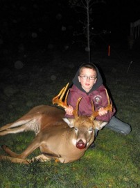 Me and ,my cousins 1st 11 point Buck